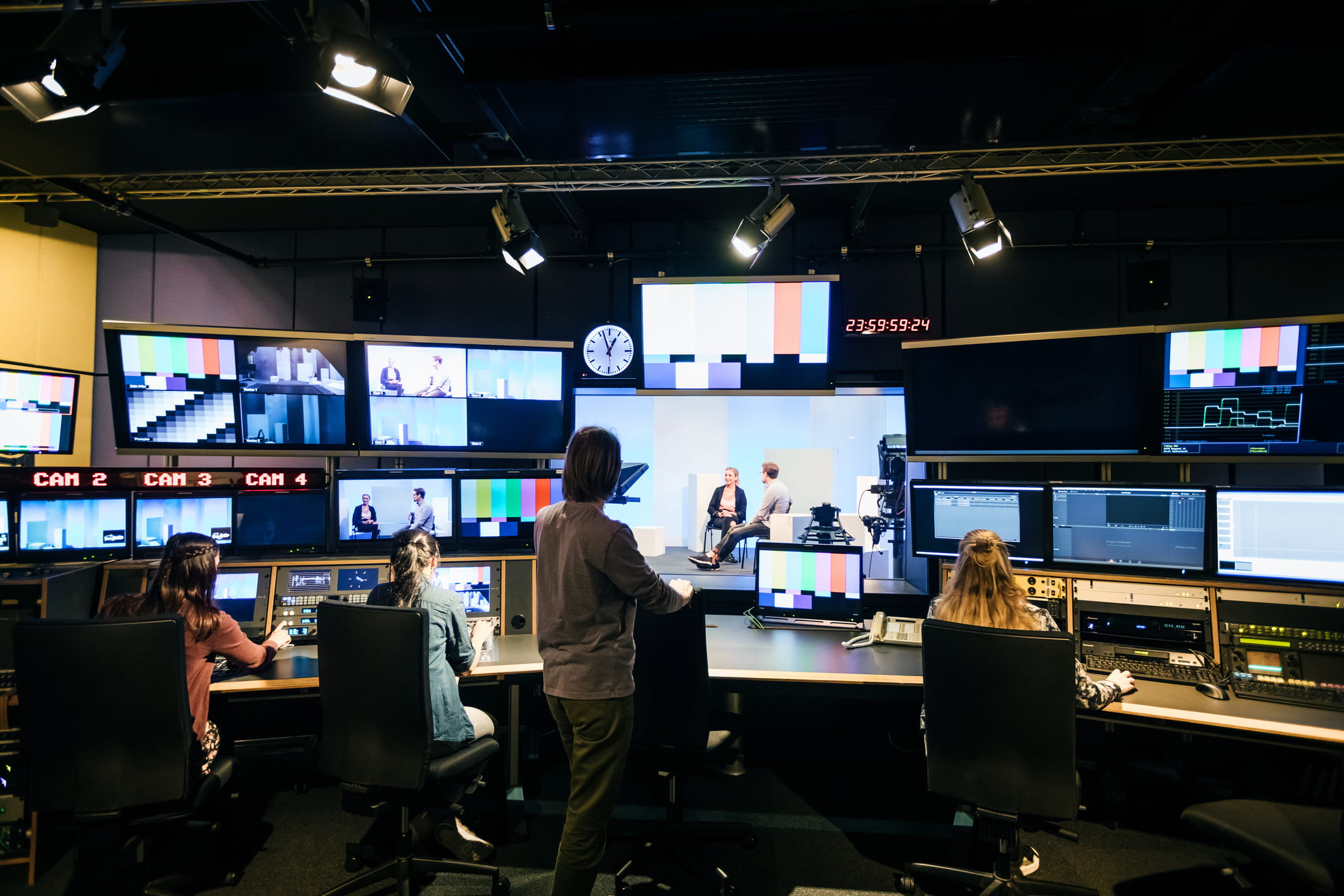 Broadcast operations team monitoring live media networks with predictive intelligence to reduce downtime, strengthen service continuity and protect audience performance