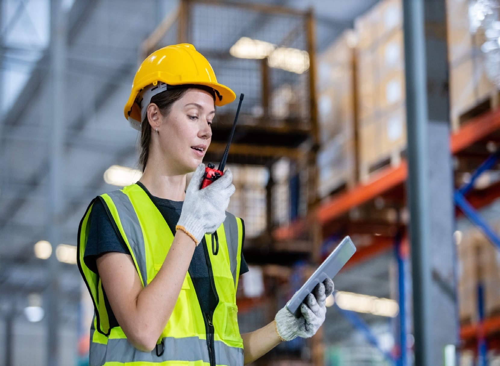 Warehouse worker using real-time inventory validation to track auditable stock movements and reduce blind spots