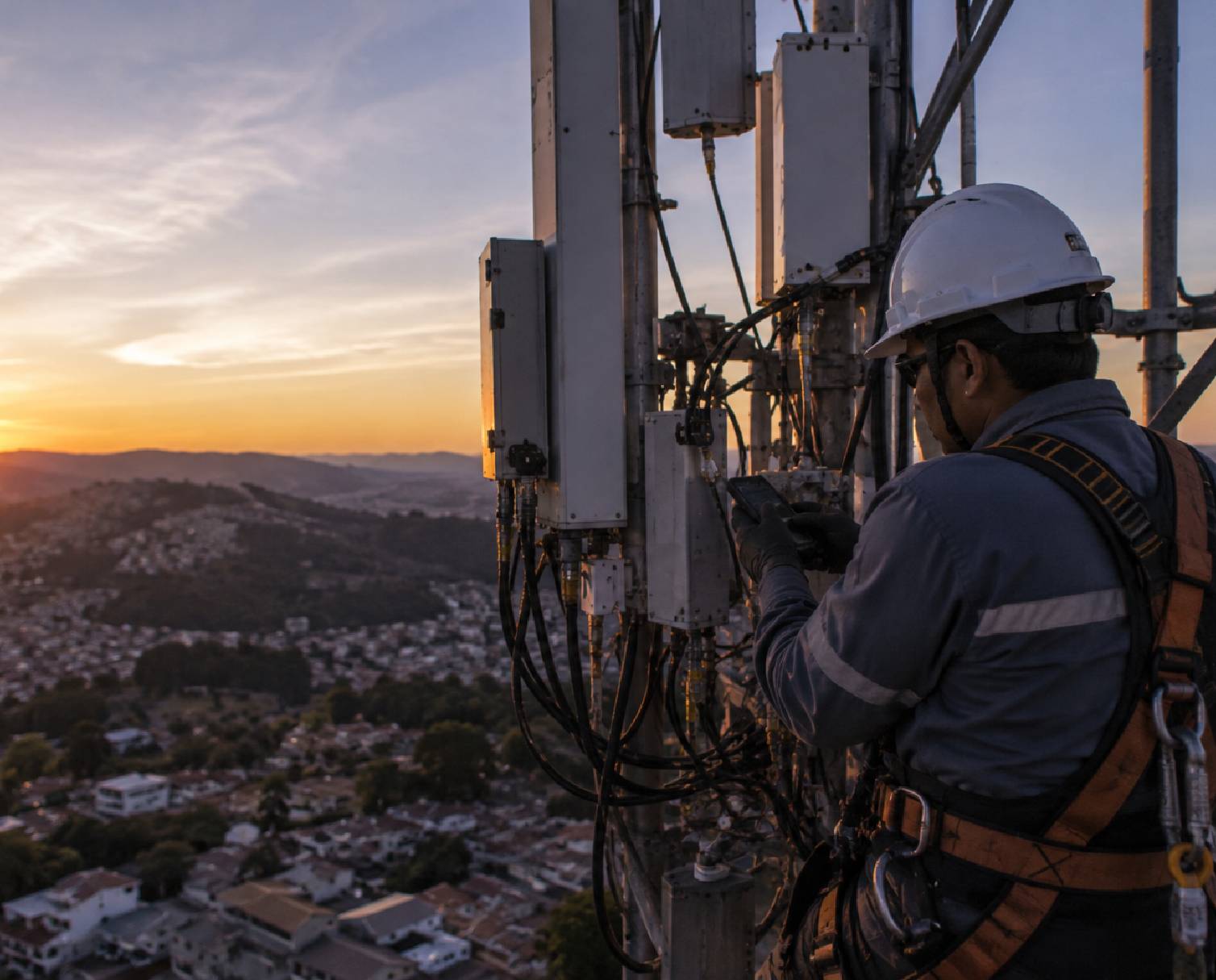 Telecom technician monitoring network infrastructure to improve service performance and operational efficiency